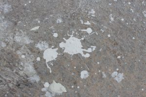 Paint stains scattered on the floor.